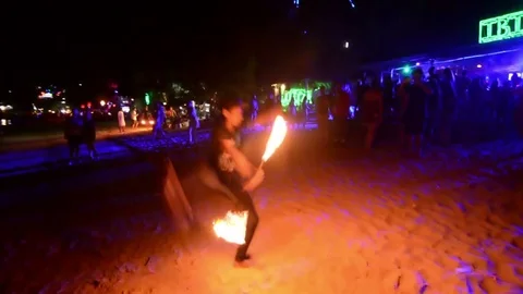Amazing fire performer in Phi Phi Island beach at night. Stock Footage