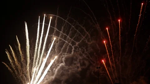 Amazing firework display exploding against dark sky Stock Footage 100520497