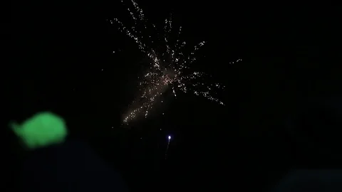 Amazing firework show. Bright splashes of flowers of salute against night sky. Stock Footage 103840923