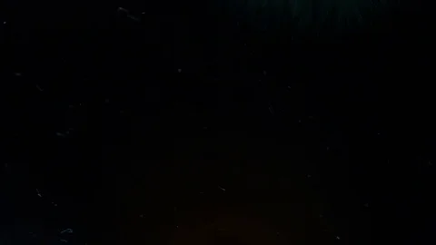 Amazing floating colored inks colliding over a dark abstract background Stock Footage 79779945