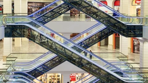 Amazing geometry of escalators at the mall. Customer traffic and buyers flow. Stock Footage 72456727