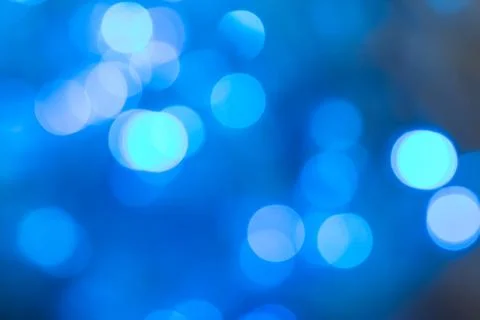 Amazing glowing blurred blue Christmas lights . New Year Stock Photos