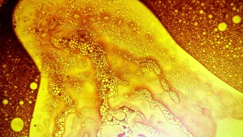 Amazing golden dye pattern appears footage of liquid art Stock Footage 124288771
