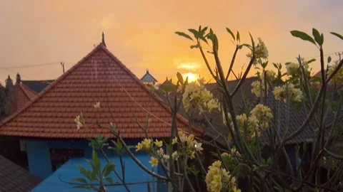 Amazing golden sunset with anamorphic lense flare in Balinese village with red Stock Footage 204860700
