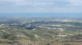 Amazing green landscape, shadows of clouds flying in sky, seascape on horizon HD Footage