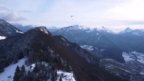 Amazing high angle top drone view. Skier paragliding above ski resort winter Stock Footage 194568525