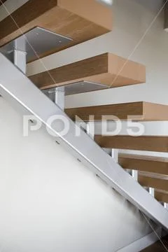 Amazing home features stainless steel staircase with wood stairs. Northwest, Stock Photos