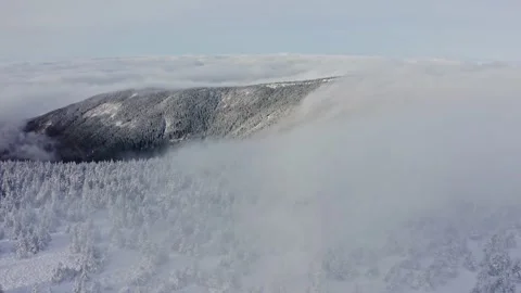 Amazing inversion clouds in mountain ridges with foggy forest trees in sunset Stock Footage 141927839