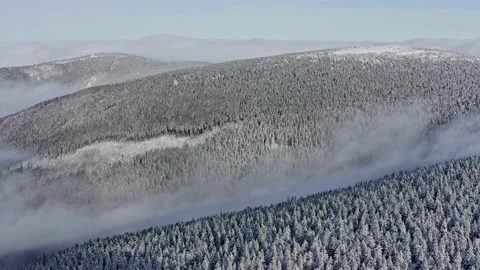 Amazing inversion clouds in mountains ridges with foggy forest trees in sunset Stock Footage 141930077