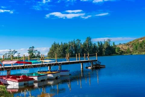 Amazing Lake Busa with a dock and boats in Girn, Ecuador Stock Photos