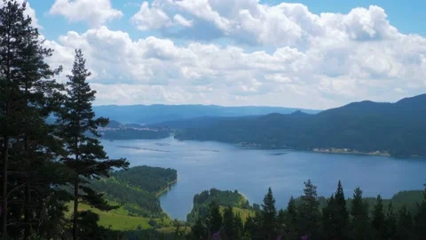 Amazing landscape of the forest lake with pine trees and mountains  Stock Footage 136080728