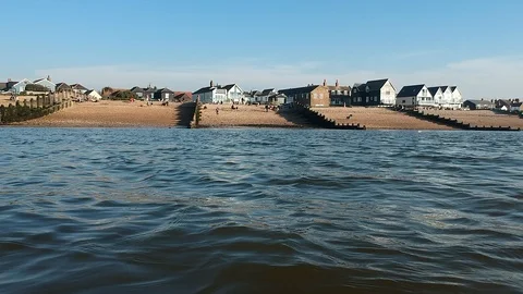 Amazing low altitude tracking drone shot of Whitstable beach &amp; town Stock Footage 107484552