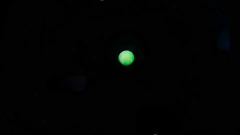 Amazing macro of a green pill dissolved in water, like a planet abstract backgro Stock Footage 126315087