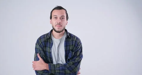 Amazing Man posing over white background Stock Footage 143943384