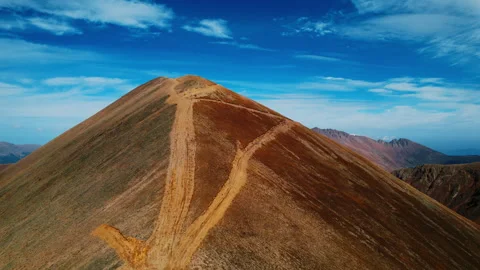 Amazing Mount Covered By Dried Red Grass Against Clear Blue Sky, Aerial Shot Stock Footage 254406348