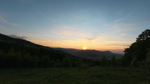 Amazing mountains with sunset clouds at spring or summer time Stock Footage 329569801