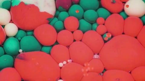 Amazing multicolored bubbles of paint on the oil surface. Paint in oil. Video stock 105177100