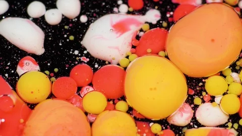 Amazing multicolored bubbles of paint on the oil surface. Paint in oil. Stockbeeldmateriaal 105181287