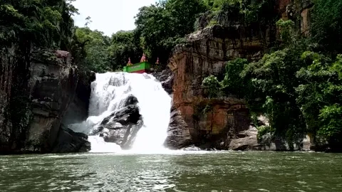 Amazing nature view on the waterfall surrounded by green plant and stones Stock Footage 167357472