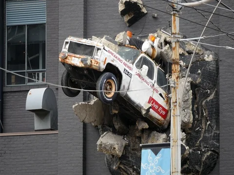 Amazing News Truck Exploding out of a Building Stock Footage 74584375