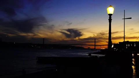 Amazing night sky with Rio Tejo Bridge over Tagus River in  Lisbon Stock Footage 244007330