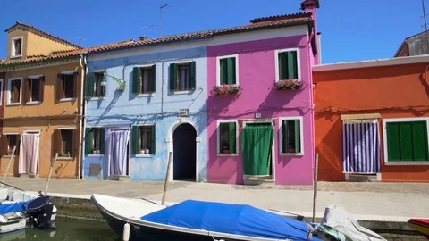 Amazing panorama of tidy colorful houses in Burano, Venice canal, architecture Stock Footage