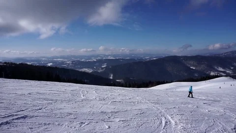 Amazing panoramic view of snow capped hill in the mountain woods on bright day Stock Footage 81550018