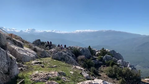 Amazing panoramic view of snow in the mountains with people far away Stock Footage 148144375