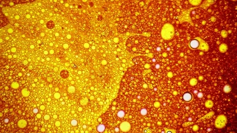 Amazing pattern appears on the surface of golden liquid with bubbles Stock Footage 124291592