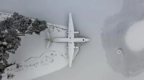 Amazing plane wreckage on lake shore Aerial view Stock Photos