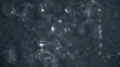 Amazing rain drops falling in slow motion 1000 fps from above, drop, bubbles Stock Footage 253564925