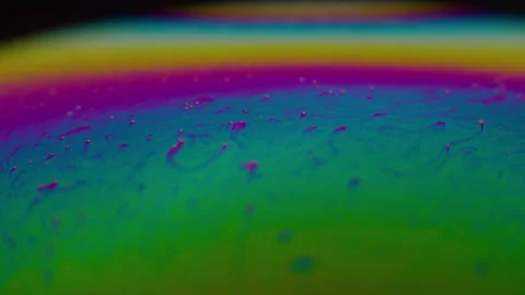 Amazing rainbow gradient background in motion. 4K. Fuel liqud. Stock Footage 159733574