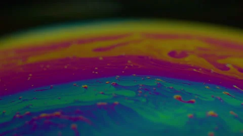 Amazing rainbow gradient background in motion. 4K. Fuel liqud. Stock Footage 159734890