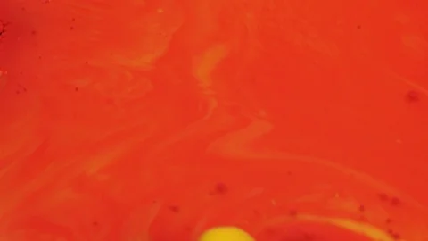 Amazing red and yellow bubbles of paint on the oil surface. Paint in oil. Stockbeeldmateriaal 105190892