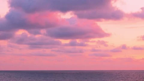 Amazing relaxing sea view multi colored sky puffy clouds sun time lapse, evening Stock Footage 334942307