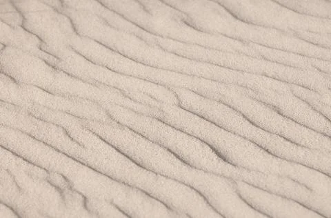 Amazing repeating background textured pattern of white sand Stock Photos