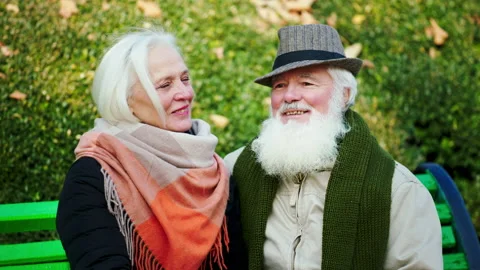 Amazing romantic old couple posing in front of the camera looking at each other Stock Footage 166636143