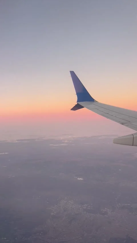 Amazing scenery during sunset from a plane window Stock Footage 334404267