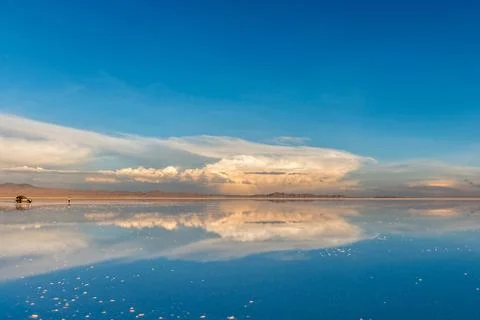 Amazing scenery of the spacious Salar de Uyuni with car on it Stock Photos