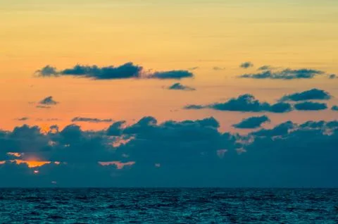 Amazing sea sunset, the sun, waves, clouds Stock Photos