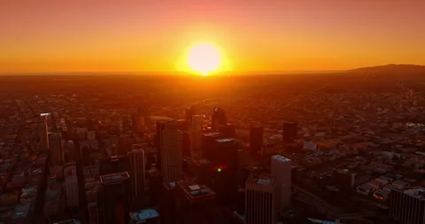 Amazing setting sun dazzles the panorama of Los Angeles, California, USA. Flying Stock Footage 328429662