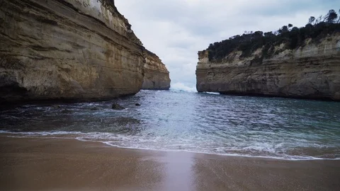 Amazing sheer size cliffs and narrow opening out to sea at Lord Ard Gorge Stock Footage 125258173
