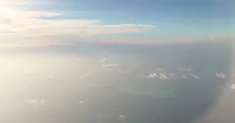 Amazing shot of fluffy clouds from an airplane window Stock Footage 238485153