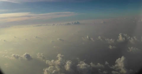 Amazing shot of fluffy clouds from an airplane window Stock Footage 238485847