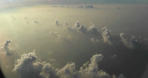 Amazing shot of fluffy clouds from an airplane window Stock Footage 238486384