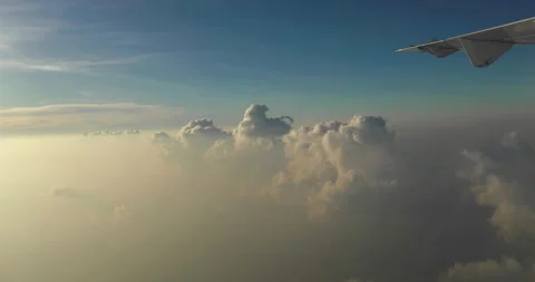Amazing shot of fluffy clouds from an airplane window Stock Footage 238486496