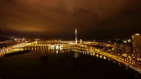 Amazing shot of Macao Tower at night with couded night sky - view from above Stock Footage 82871791