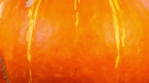 Amazing side of orange pumpkin close up, rotating contra clockwise Video stock 78348861