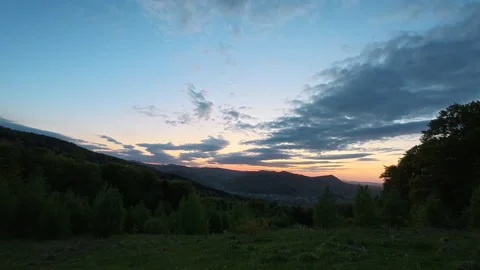 Amazing spring sunset or sunrise in mountains. Wind sway grass landscape Stock Footage 329574584