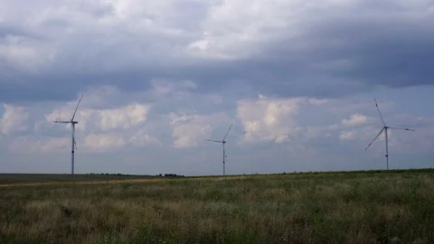 Amazing steady view on cloudy blue sky over big wind power turbine generator Stock Footage 95314802
